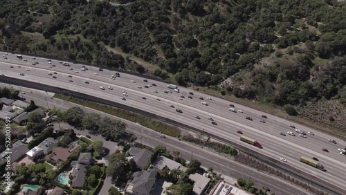 Aerial Panning Shot Of Cars Moving On Roads In City, Drone Flying During Sunny Day -  Beverly Hills, California