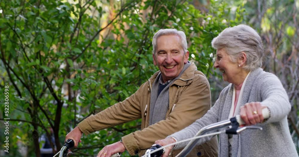 Happy, fun and mature couple talking while walking in a park together, happy and excited to go on a bike ride outdoors. Active seniors enjoying healthy activities while bonding and being cheerful Happy, fun and mature couple talking while walking in a park together, happy and excited to go on a bike ride outdoors. Active seniors enjoying healthy activities while bonding and being cheerful