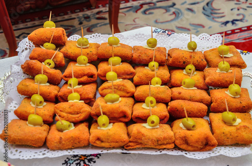 Moroccan salty and sweet appetizers are served at weddings and birthdays. The concept of cooking in Morocco photo