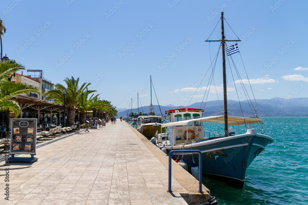 Nafplio, Greece, July 19, 2022. Restaurants on the embankment along the sea