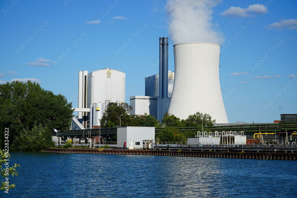Coal fired power plant with stone coal dump. An old technology that is partly responsible for global warming. Hanover, Germany Coal fired power plant with stone coal dump. An old technology that is partly responsible for global warming. Hanover, Germany
