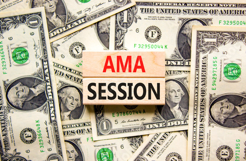 AMA ask me anything session symbol. Concept words AMA ask me anything session on wooden blocks on a beautiful background from dollar bills. Business and AMA ask me anything session concept. Copy space