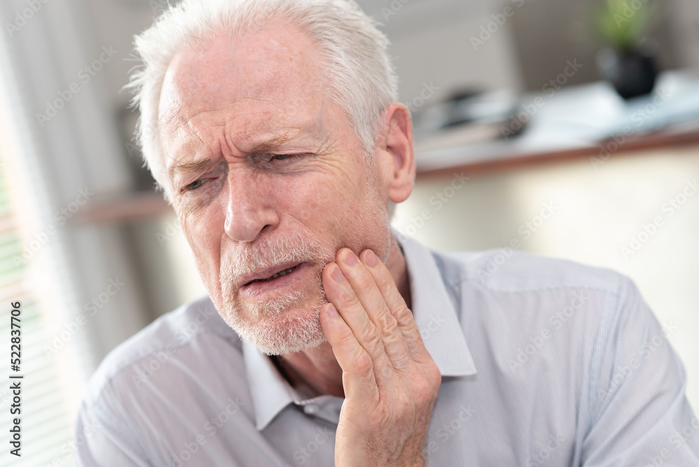 Senior man suffering from toothache