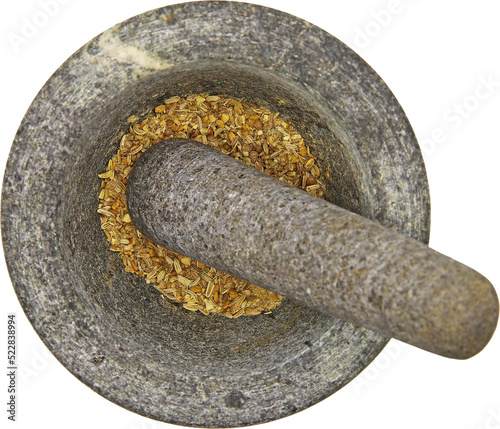 Top view close up on isolated gray basalt stone mortar with  pestle and spices, transparent background photo