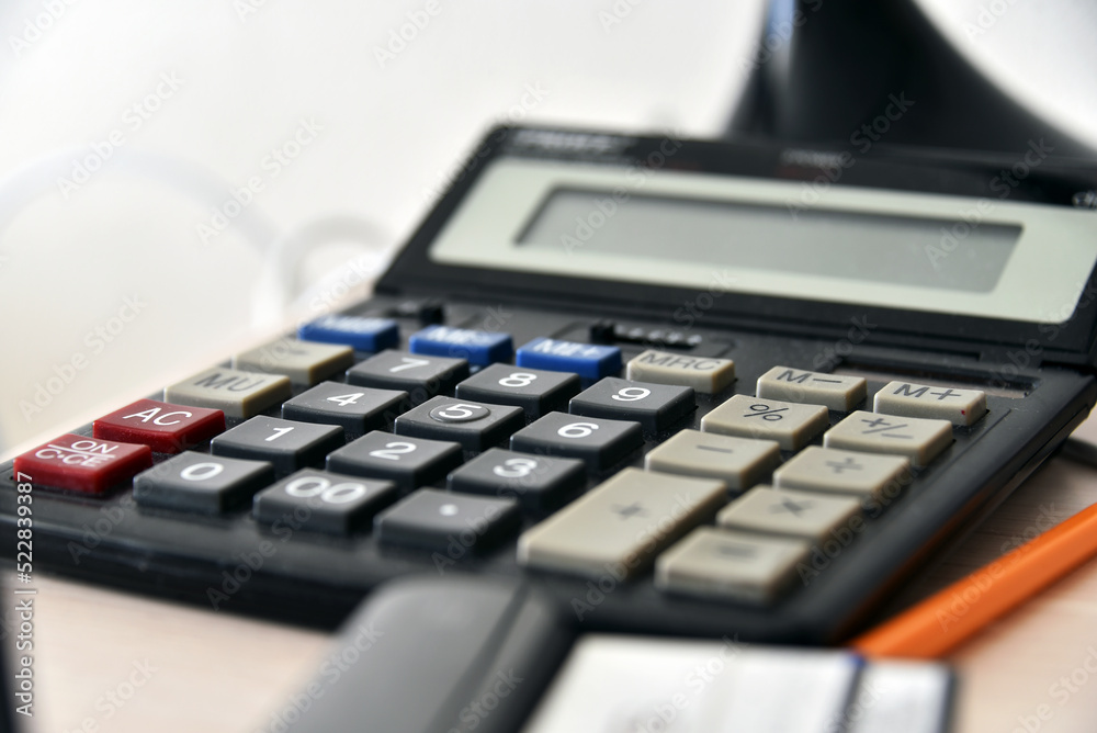 Office calculator close up. Selective focus. Office calculator close up. Selective focus.