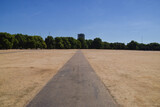 A parched Hyde Park on a scorching day as heatwaves and drought caused by climate change continue in the UK