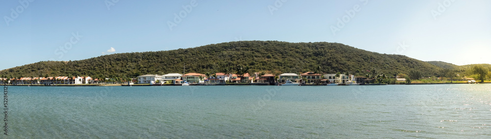 bayfront mansion houses in condominium in a forested island. Panoramic