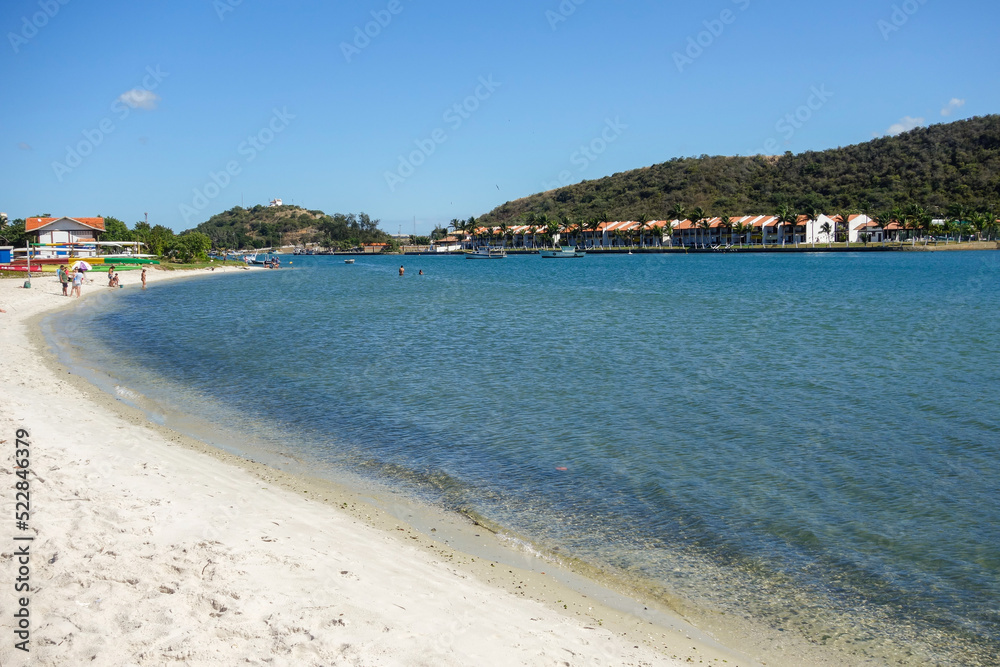 Cabo Frio, Brazil: bayfront mansion houses in calm beach at sunny day
