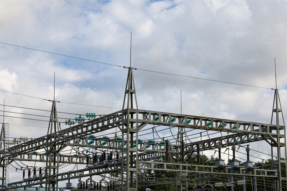 Fototapeta premium Power station and cables, blue sky and clouds background