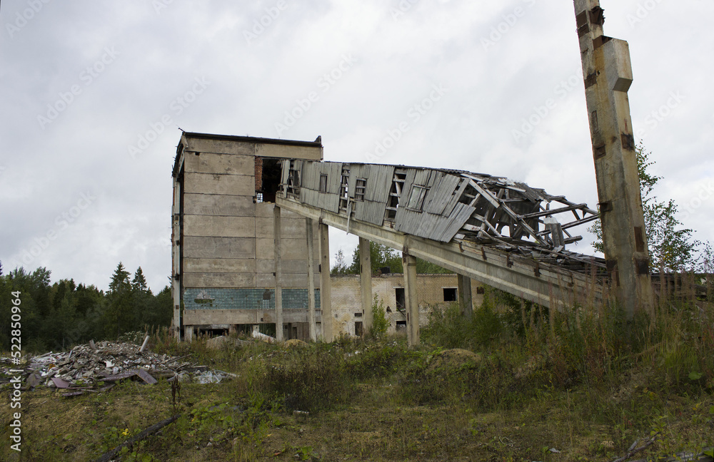 abandoned ruined building. concrete walls with broken windows and a lift, industrial buildings. victory of nature over industry and progress, devastation abandoned ruined building. concrete walls with broken windows and a lift, industrial buildings. victory of nature over industry and progress, devastation