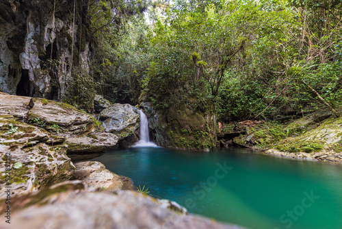 Guanayara, Cuba - January 6, 2021: Waterfalls at Gruta Nengoa at Guanayara National Park Cuba photo