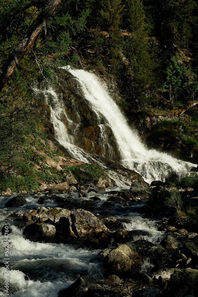 Waterfall of Lake Poperechnoe on the Multa River in the Katunsky Reserve of Altai Waterfall of Lake Poperechnoe on the Multa River in the Katunsky Reserve of Altai