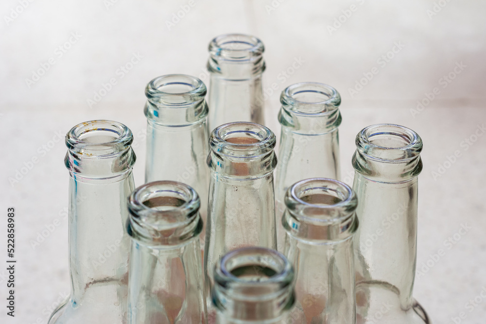 Close up empty soft drinks glass bottles. Recycled glass concept. Close up empty soft drinks glass bottles. Recycled glass concept.