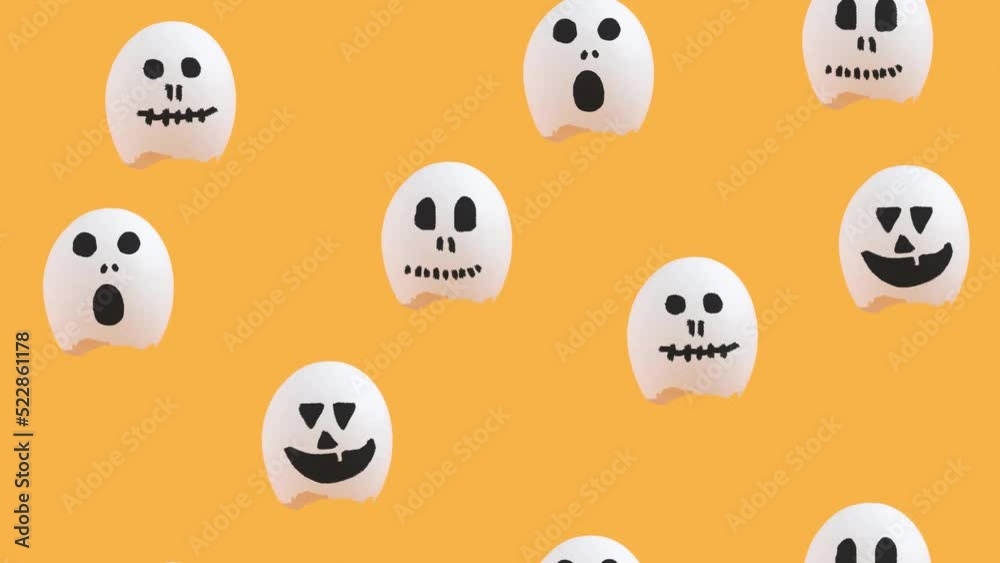 Funny creative Halloween concept with flying eggshells painted as ghost characters 4k.