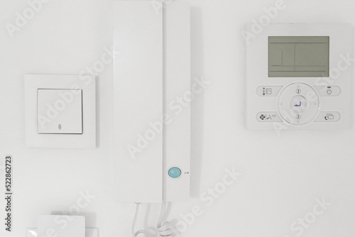 light switch, intercom handset, room air conditioning and full card light switch (card switch). Entrance to the room, apartment. Electronics in the house