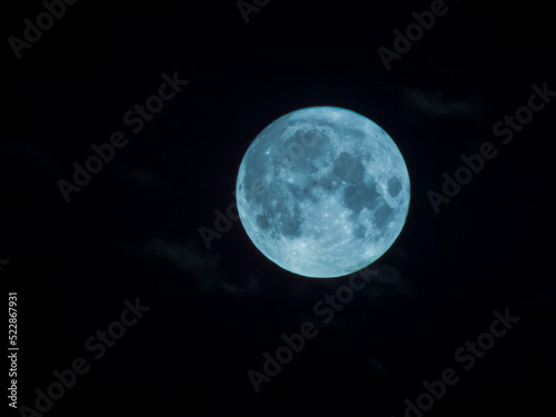 Close-up photo of the full moon against a dark sky