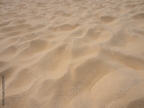 Natural texture background of fine clear beach sand and dune