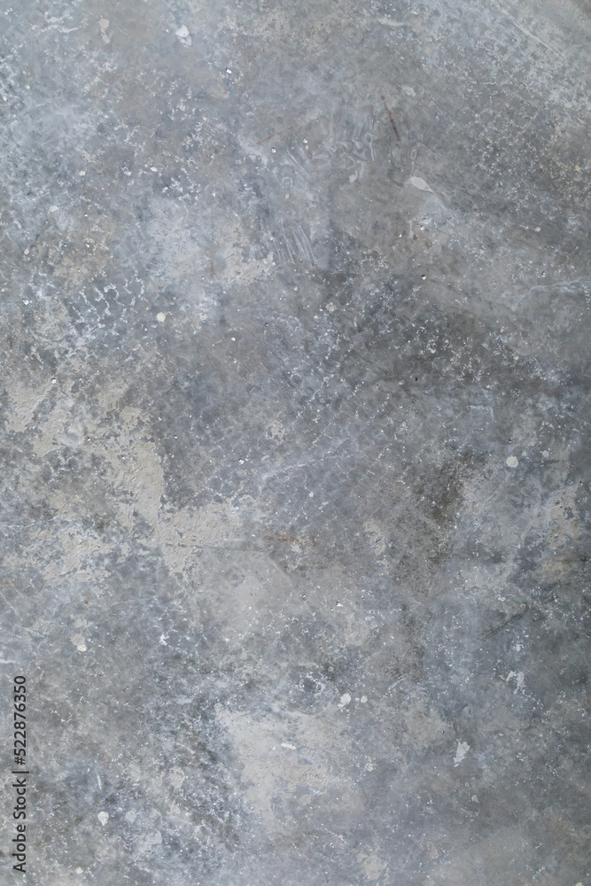 Fototapeta premium Close-up image of a bare cement concrete slab floor in a house being remodeled