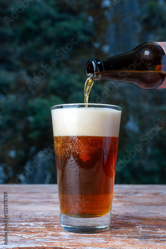 Fotografi Beer pouring in the glass