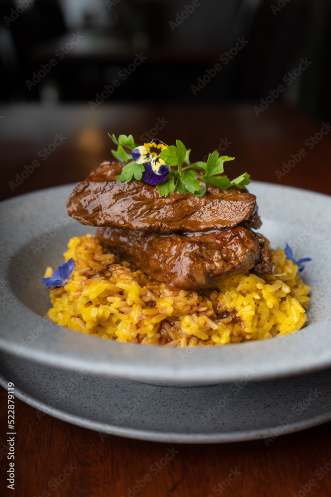 Risotto with meat stew in an Italian restaurant.