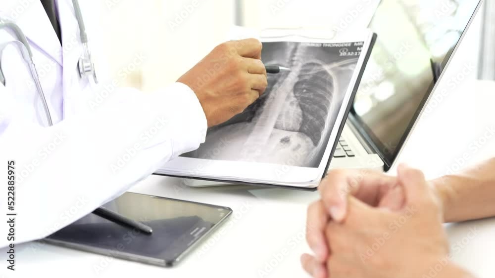 Asia male medic service people or help talk discuss of medical exam record test result at clinic office desk. Asia male medic service people or help talk discuss of medical exam record test result at clinic office desk.