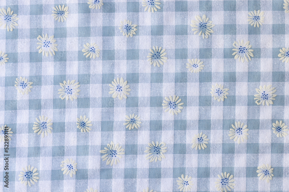 Plaid fabric with floral print textured background