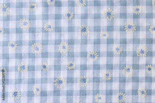 Plaid fabric with floral print textured background