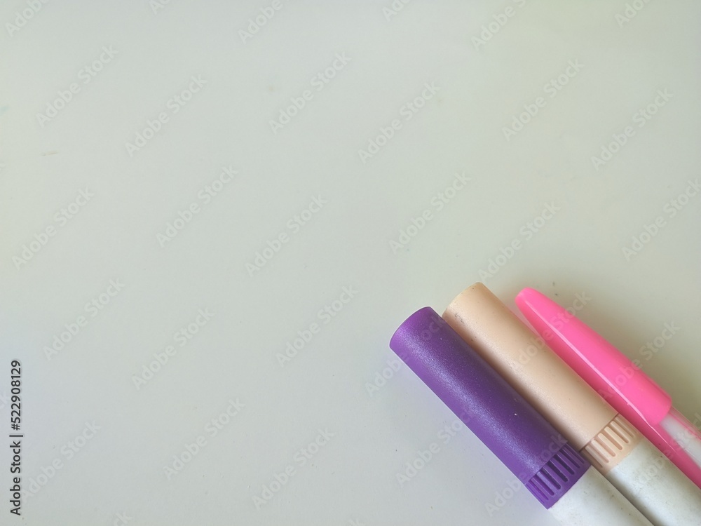Office and school stationery on edge of background