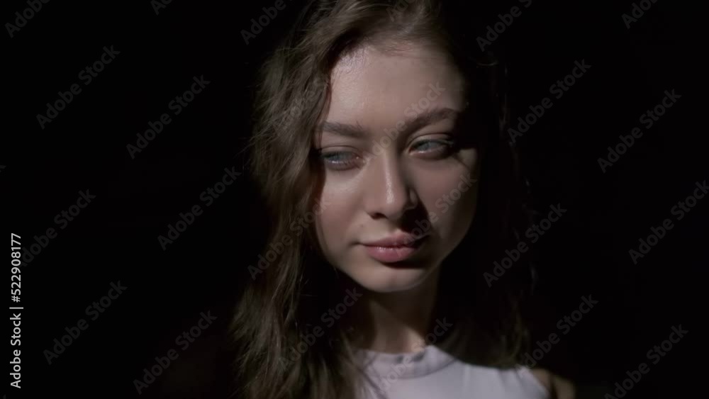 Close-up of girl drinking coffee with pleasure from a white cup