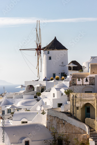 Whitewashed houses and windmills in Oia on Santorini island  Cyclades  Greece