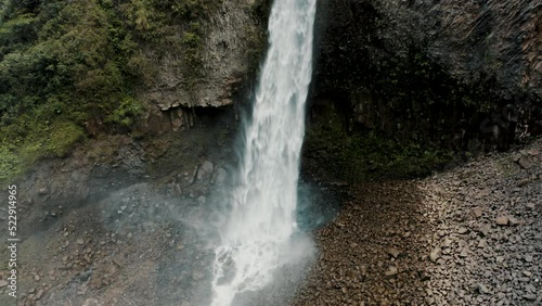 Cascading Waterfall Of Manto de la Novia In Baños, Ecuador - aerial drone shot