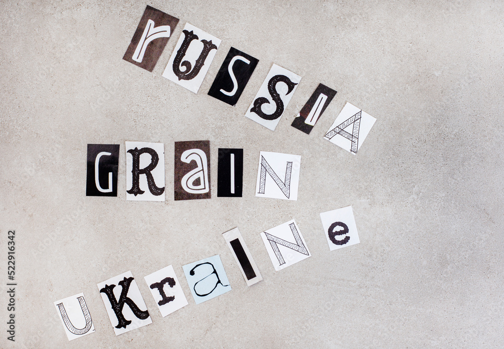 Russia, Ukraine and grain written in magazine clippings on grey Russia, Ukraine and grain written in magazine clippings on grey