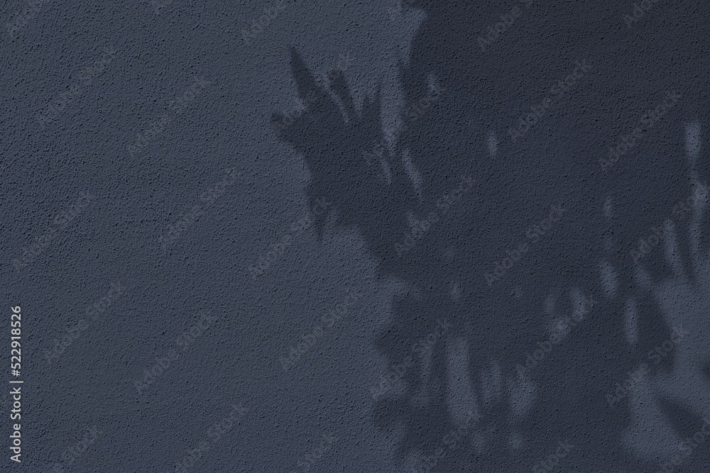 Abstract tree leaves shadows on dark gray concrete wall texture with ...