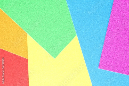 Abstract creative texture geometric pattern from craft paper background. Rainbow colors. Structure design cardboard poster shape backdrop. Top view with copy space for text, flat lay, close-up