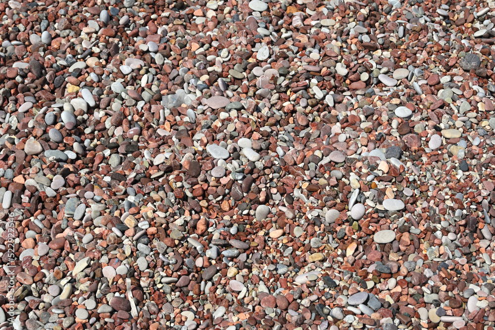 Pebbles on the beach, natural background of small stones Pebbles on the beach, natural background of small stones