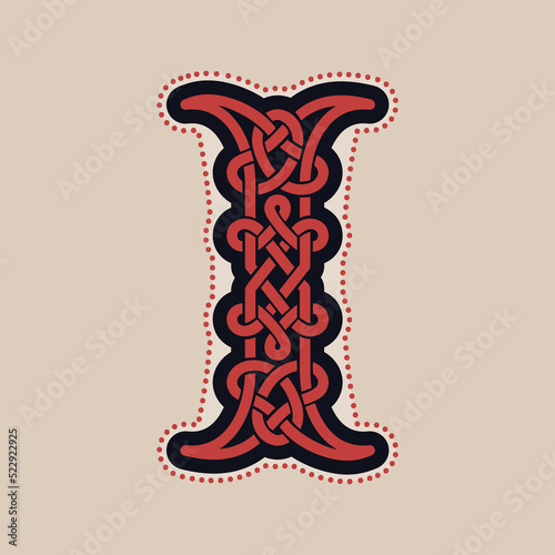 I letter logo with Celtic knots, spiral lines, and red dots. Dim colored medieval initial.