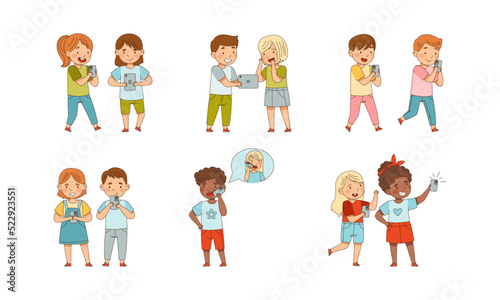 Little Children with Smartphone and Tablet pc Playing and Surfing Internet Vector Set