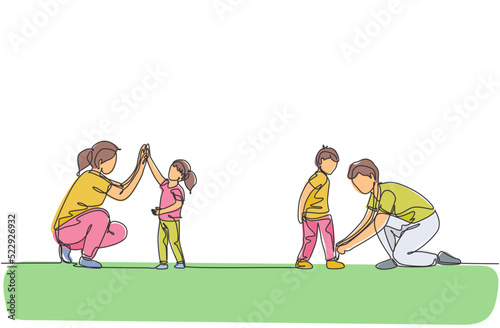 One continuous line drawing of young mom giving high five to daughter and father tying his son shoelaces. Happy family parenting concept. Dynamic single line draw design vector illustration