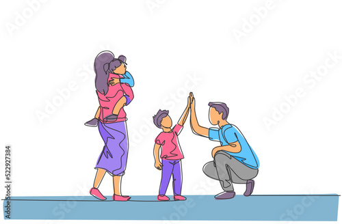 One single line drawing of young father giving high five to his son while mother carrying sleepy daughter vector illustration. Happy family parenting concept. Modern continuous line draw design © Simple Line