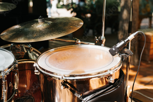 Close-up of a drum set at a street music festival. Snare drum and microphone, selective focus
