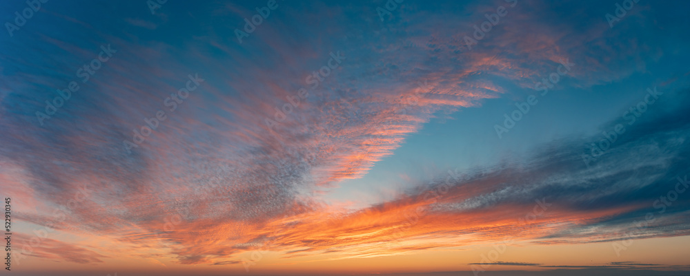 Widescreen Panorama Of The Sunset Sky After The Sun Has Gone Below The Horizon. Only The Sky Above The Horizon. Cirrus Low Clouds. Dramatic Sunset.