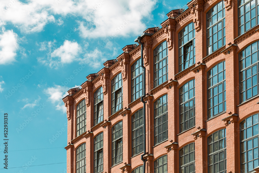 Loft building facade. Windows of the  factory building.