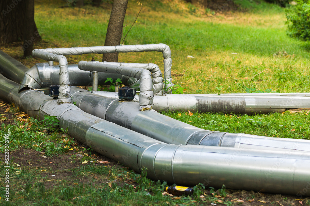 Pipeline on the lawn. Pipes on the grass. Pipeline on the lawn. Pipes on the grass.