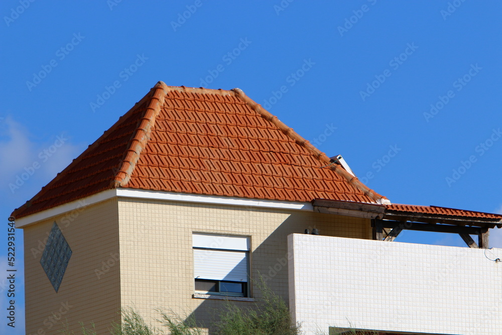 Red tiled roof on a residential building.