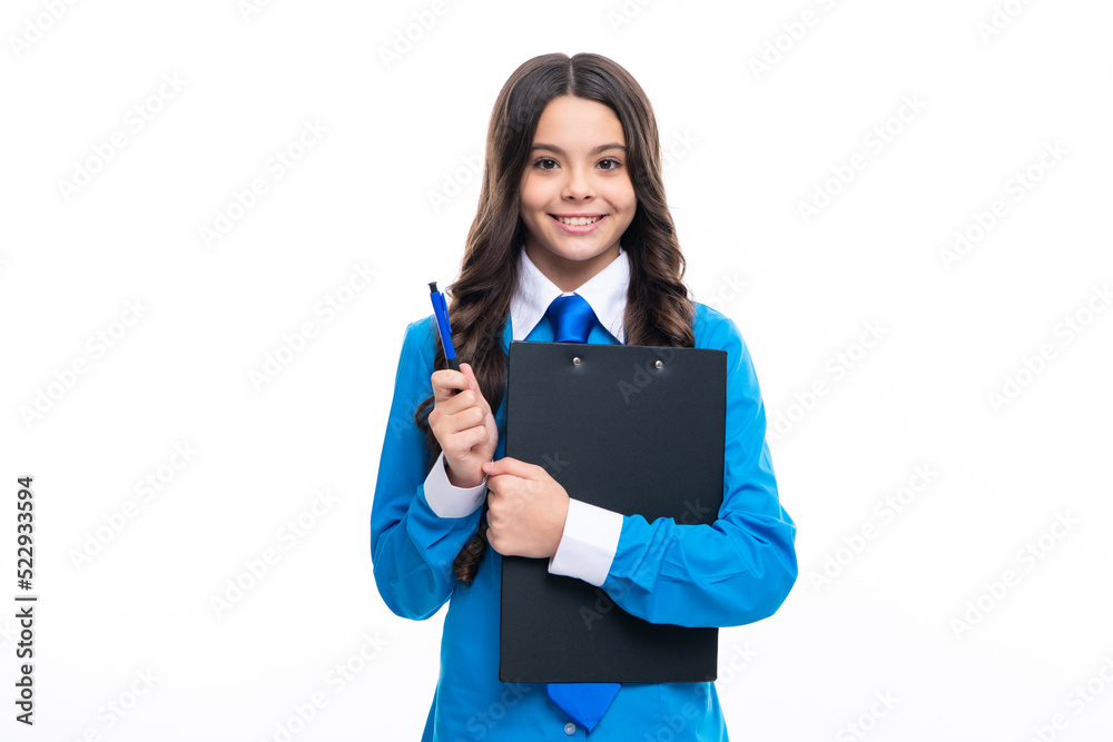 Serious teenager girl in shirt and tie wearing office uniform holding clipboard on white isolated background. Serious teenager girl in shirt and tie wearing office uniform holding clipboard on white isolated background.
