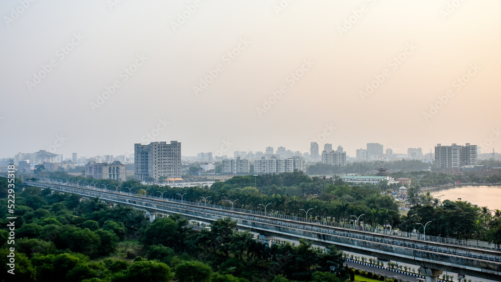 Indian cityscape aerial view with buildings roads and over bridge of Kolkata