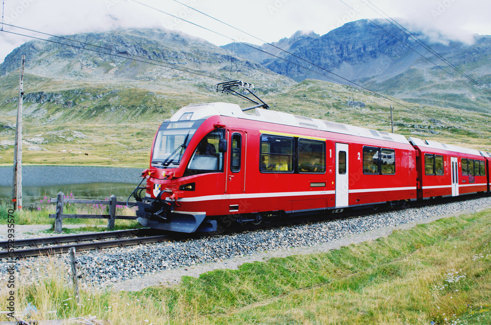 Obraz premium Swiss mountain train Bernina Express crossed Alps. St.Moritz, Switzerland