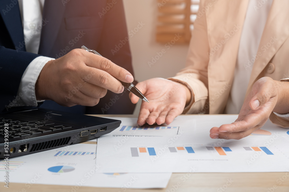 Business persons discuss on paper document chart and graph report teamwork and leadership concept Business persons discuss on paper document chart and graph report teamwork and leadership concept
