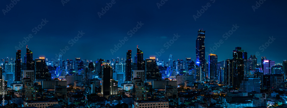 Obraz premium Concept of financial business Technology and travel in Asia cityscape urban landmark,bangkok at night district dusk sky.Thailand night city skyline with modern Bangkok skyscraper architecture building