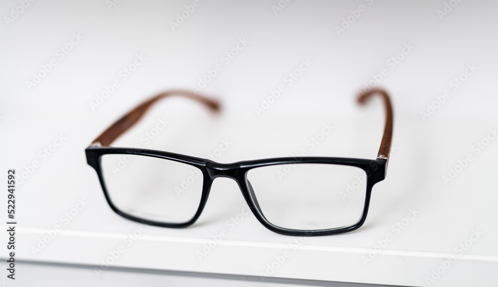 Stylish modern eyesight glasses. Eyewear accessory in white background.